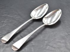 A pair of George III silver serving spoons, Old English pattern with engraved initials and pip