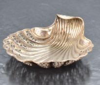 A Victorian silver scallop shell-form dish, having embossed, pierced and engraved decoration,