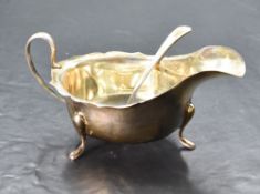 A George V silver gravy boat, of traditional design, marks for Sheffield 1934, maker Viners, 14.5cm,