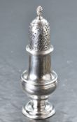 An early George III silver sugar caster, of traditional design with domed and pierced finial