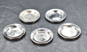 A group of five Edwardian silver miniature saucers, of plain dished circular form, marks for Chester