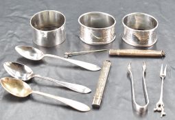 A small selection of miscellaneous silver and white metal items, to include spoons, napkin rings,