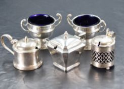 A pair of George V silver salts, of circular form with moulded central bands and two scrolled