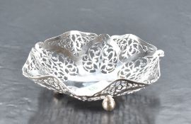 A George V silver bonbon dish, of ruffled and dished for with pierced scrolling and heart-shaped