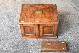 An early 20th century walnut canteen, of rounded rectangular form with moulded edge detail enclosing