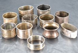 A group of eleven mixed silver napkin rings, differing design, age and maker 267grams gross