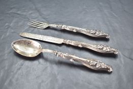 A Victorian silver christening set, comprising silver bladed knife, fork and spoon, the handles with
