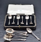 A cased set of six George V silver Hanovarian pattern coffee spoons, with rattail reverse, marks for