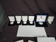 A collection of six Silver Proof Coins, Jersey 2008 £5 Poppy Coin, UK Charles & Diana 1981 Crown,