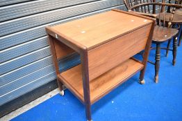 A vintage teak tea trolley