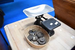 A set of vintage style kitchen scales and a selection of weights