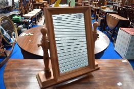 A modern pine toilet mirror, height approx. 40cm