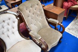 A Victorian mahogany armchair having scroll frame and later dralon upholstery