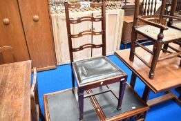 An early 20th Century mahogany dining chair having shaped ladder back and drop in seat