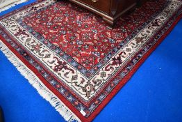 A traditional wool rug, approx. 207 x 137cm