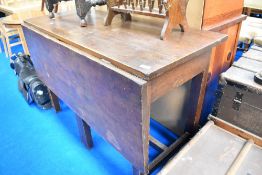 A traditional kitchen work table having single drop flap and scumbled style finish, width approx.