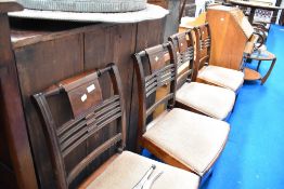 A set of four Victorian mahogany dining chairs have later upholstered drop on seats