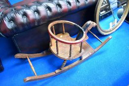 A Victorian baby or toddler rocking horse having turned frame