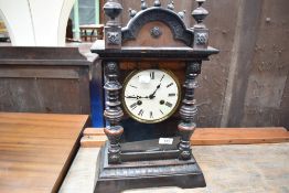 A late 19th or early 20th Century stained frame mantel clock