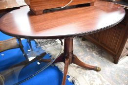 An interesting reproduction Regency style coffee/dining table having adjustable height mechanism,