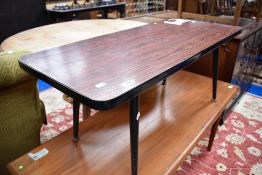 A vintage melamine topped coffee table on dansette legs