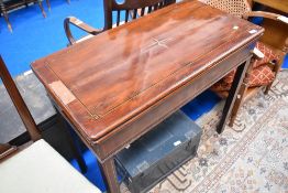 A 19th Century mahogany and inlaid fold over tea table