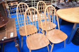 A set of four Ercol high back kitchen dining chairs