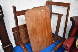 A Victorian mahogany dining table, as found