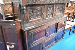 A period oak court cupboard , in the Westmorland style, carved monogram and date to frieze