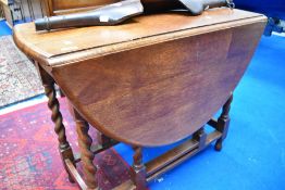 An oak twist gate leg dining table