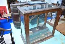 A set of vintage Griffin an Tatlock lab scales in oak and glazed case