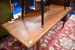A vintage teak coffee table, width approx 130cm, depth 52cm