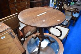 A 19th Century oak pedestal table having circular top turned column and triple splay legs
