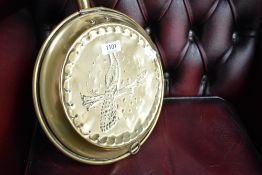 A traditional copper warming pan