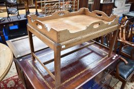 A 19th Century bleached mahogany butlers tray and stand