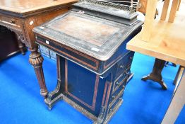 A 19th Century ebonised davenport having walnut inlay, in need of restoration
