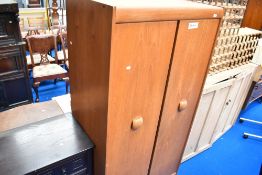 A vintage teak wardrobe , labelled EON