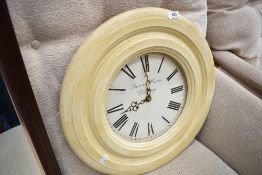 A modern shabby chic effect circular wall clock, diameter approx. 47cm