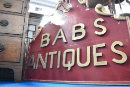 A vintage sign with light fittings attached, Bab's Antiques