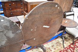 A 19th Century mahogany circular pedestal table having snap top