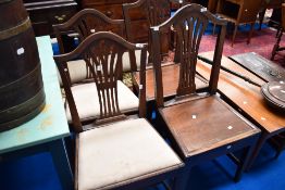 A pair of 19th Century dining chairs having splat backs and upholstered seats