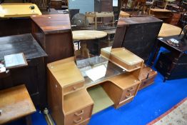 A vintage golden oak dressing table, labelled E Gomme, G Plan