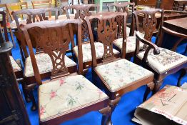 A set of seven (six plus one) George III mahogany dining chairs on the Chippendale style with drop