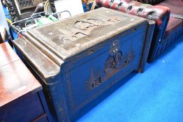 An Oriental camphor wood bedding chest