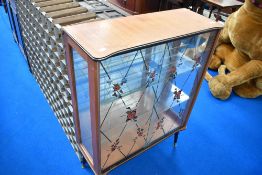 A 1950s glazed china cabinet on dansette style legs