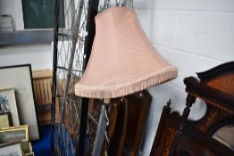 A wrought iron standard lamp
