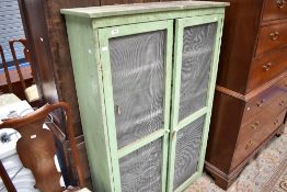 A rustic larder food cupboard/meat safe