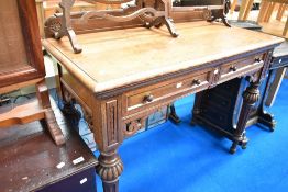 A Victorian oak side table having ledge back , two frieze drawers , width approx. 114cm