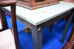 A vintage part painted kitchen table