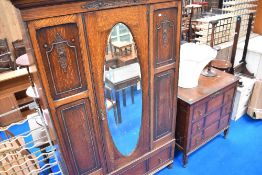 An early 20th Century oak wardrobe and dressing table